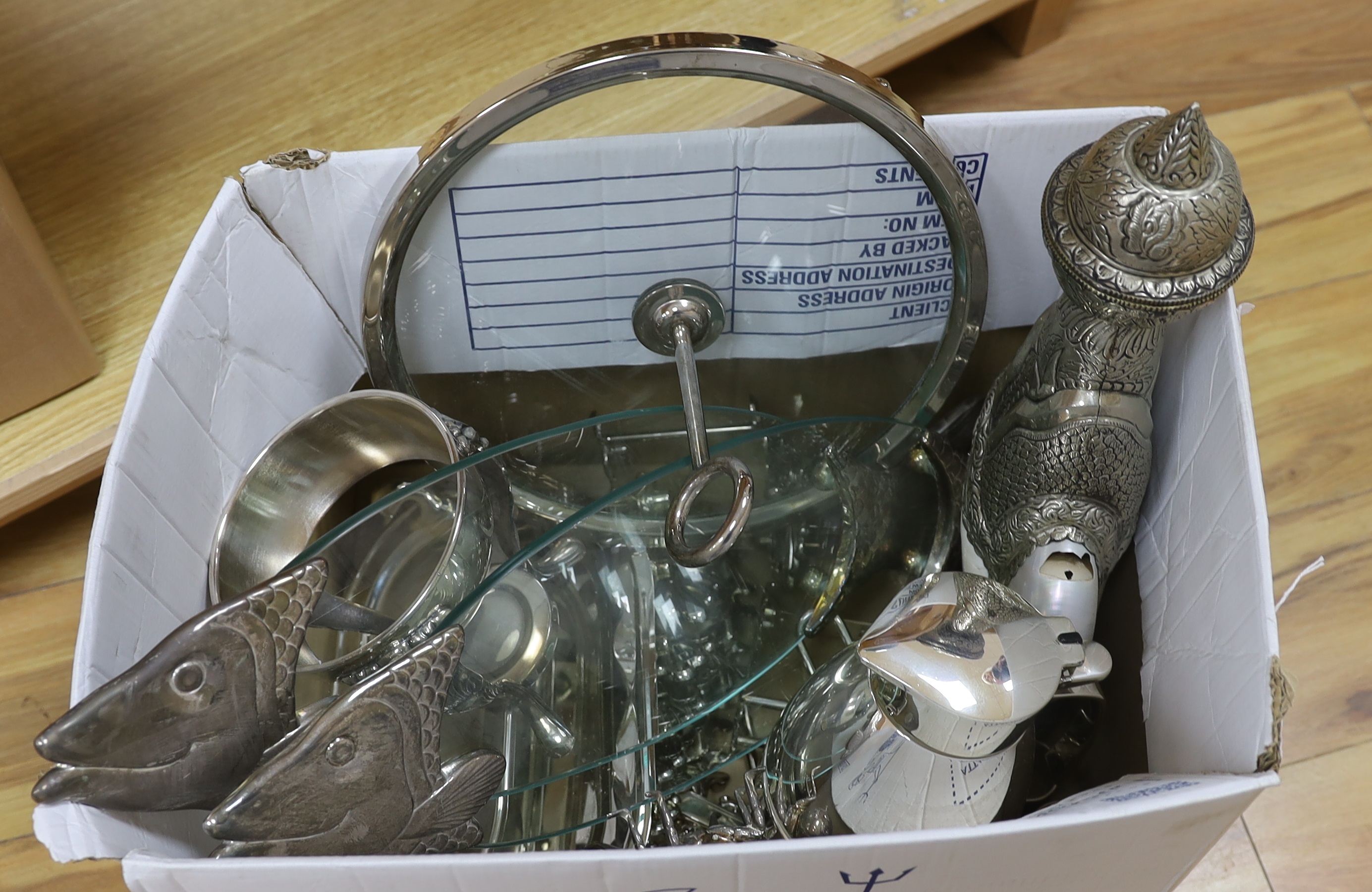 A collection of plated wares including fish serving dishes, insect sauce container and a circular glass tray